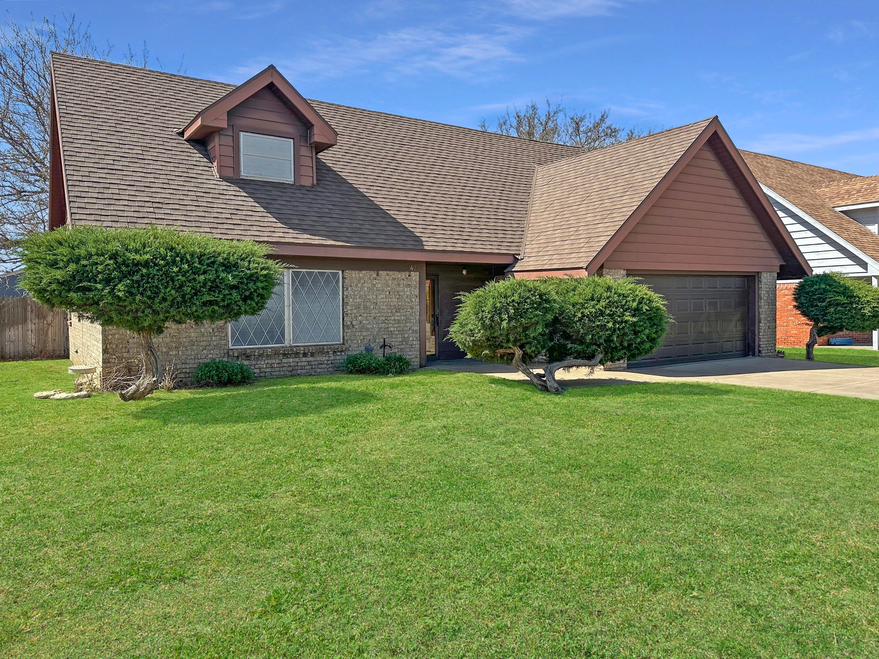 1421 Marigold Street Borger, TX 79007 - Photo 1 of 26 front view of a house with a yard