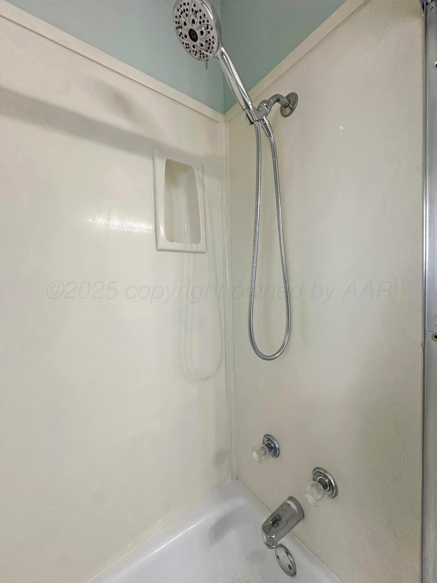 1421 Marigold Street Borger, TX 79007 - Photo 13 of 26 a bathroom with a bath tub