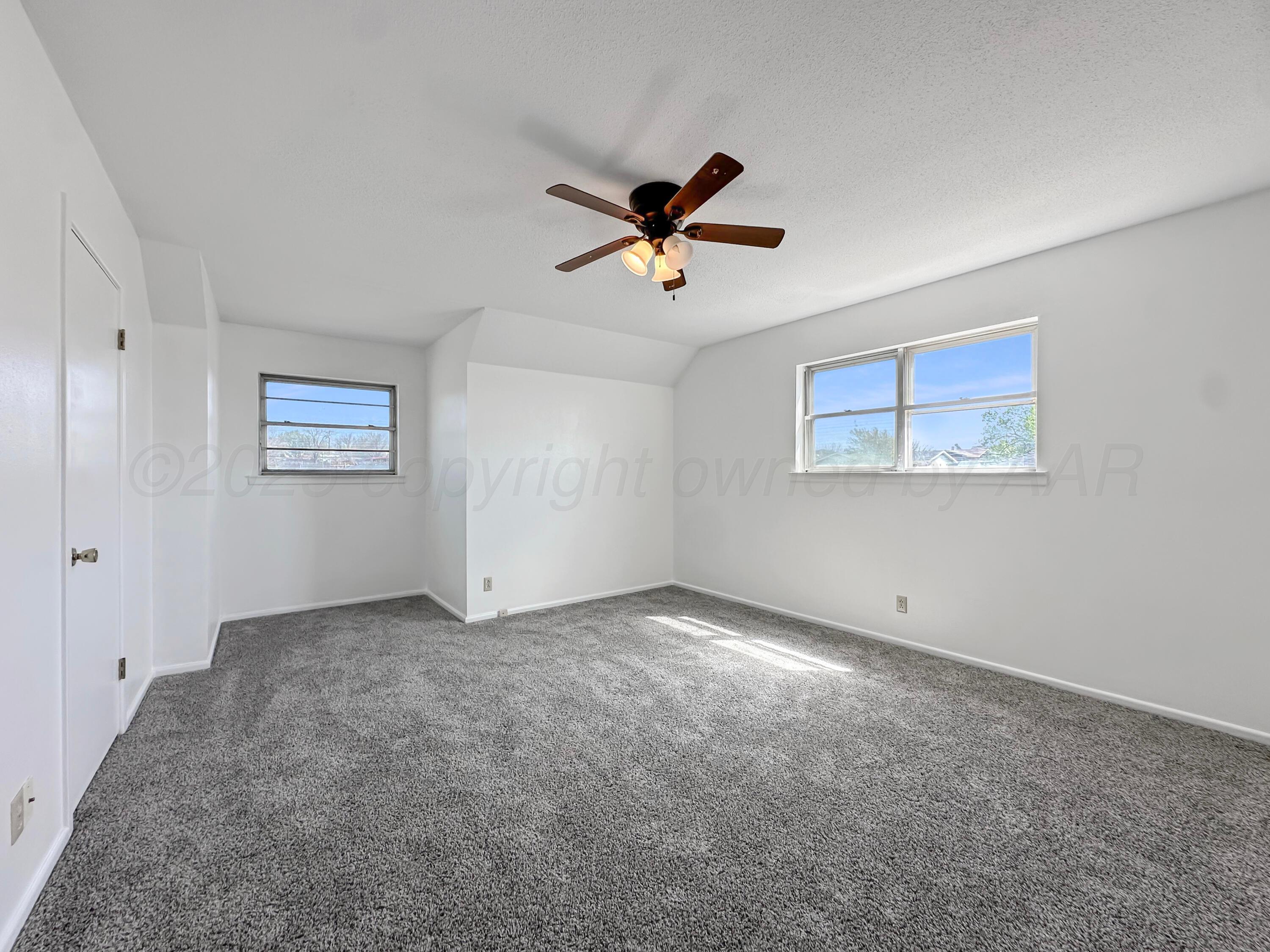 1421 Marigold Street Borger, TX 79007 - Photo 18 of 26 a view of an empty room with a window