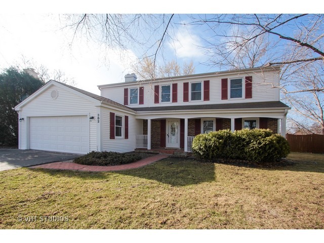 382 Northgate Road Lindenhurst, IL 60046 - Photo 1 of 10 a front view of a house with a yard