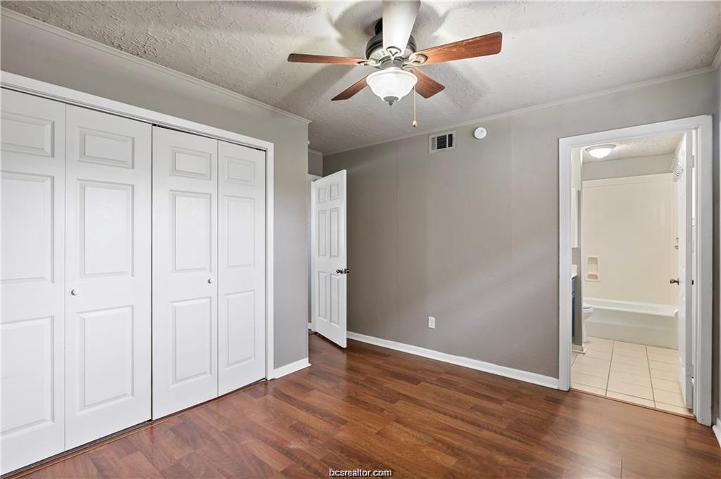 3906 Aspen Street, Unit D Bryan, TX 77801 - Photo 12 of 13 a view of an empty room with wooden floor