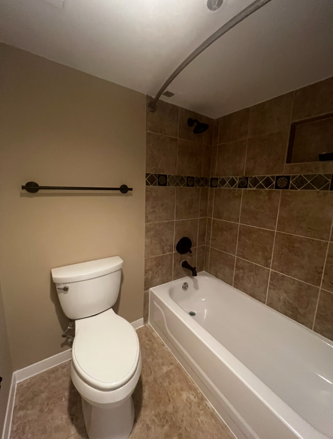 3525 Sage Road, Unit 1708 Houston, TX 77056 - Photo 11 of 14 a white bath tub sitting next to a toilet