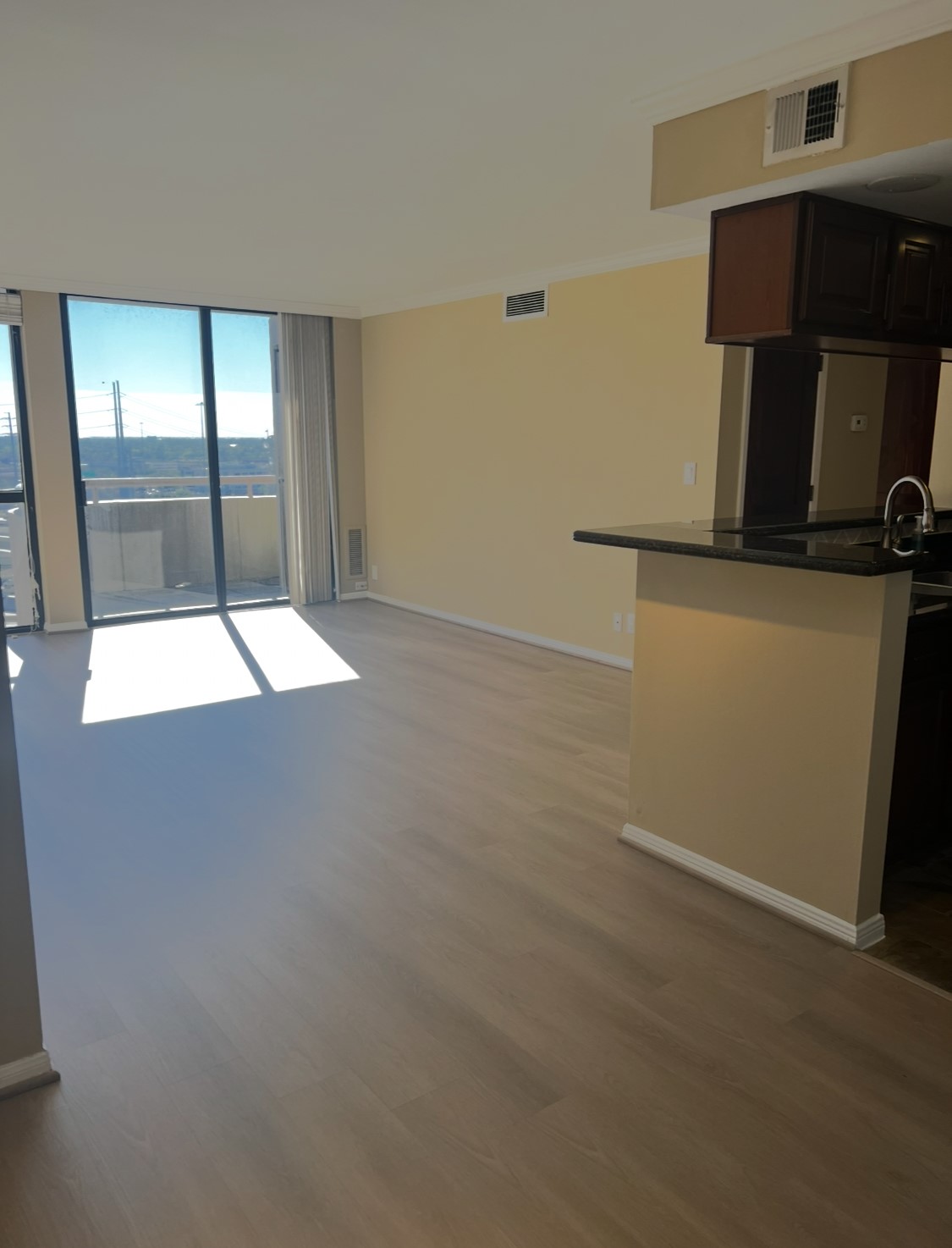3525 Sage Road, Unit 1708 Houston, TX 77056 - Photo 2 of 14 an empty room with wooden floor and windows