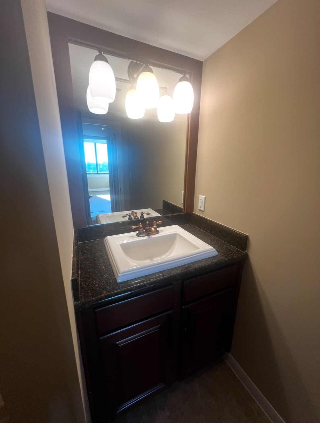 3525 Sage Road, Unit 1708 Houston, TX 77056 - Photo 10 of 14 a bathroom with a sink and a mirror