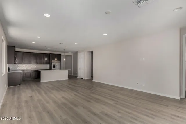 a view of kitchen with kitchen island microwave and stove