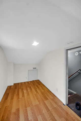 a room with a bed and pillows