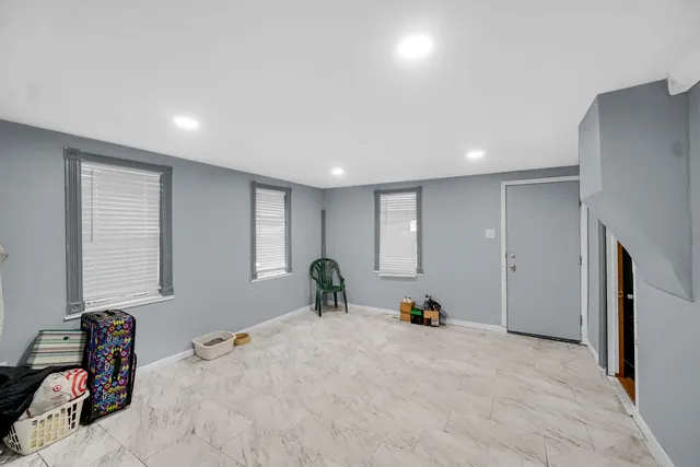 a bed room with a bed and a window