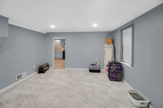 a view of room with stairs and a window