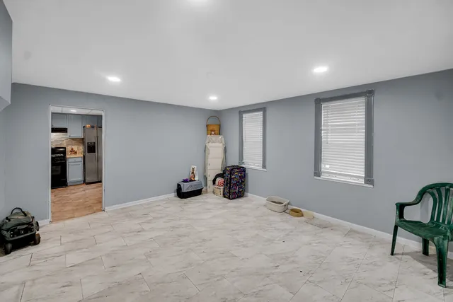 a view of a livingroom with furniture and windows