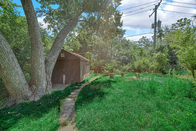 a backyard of a house with lots of green space