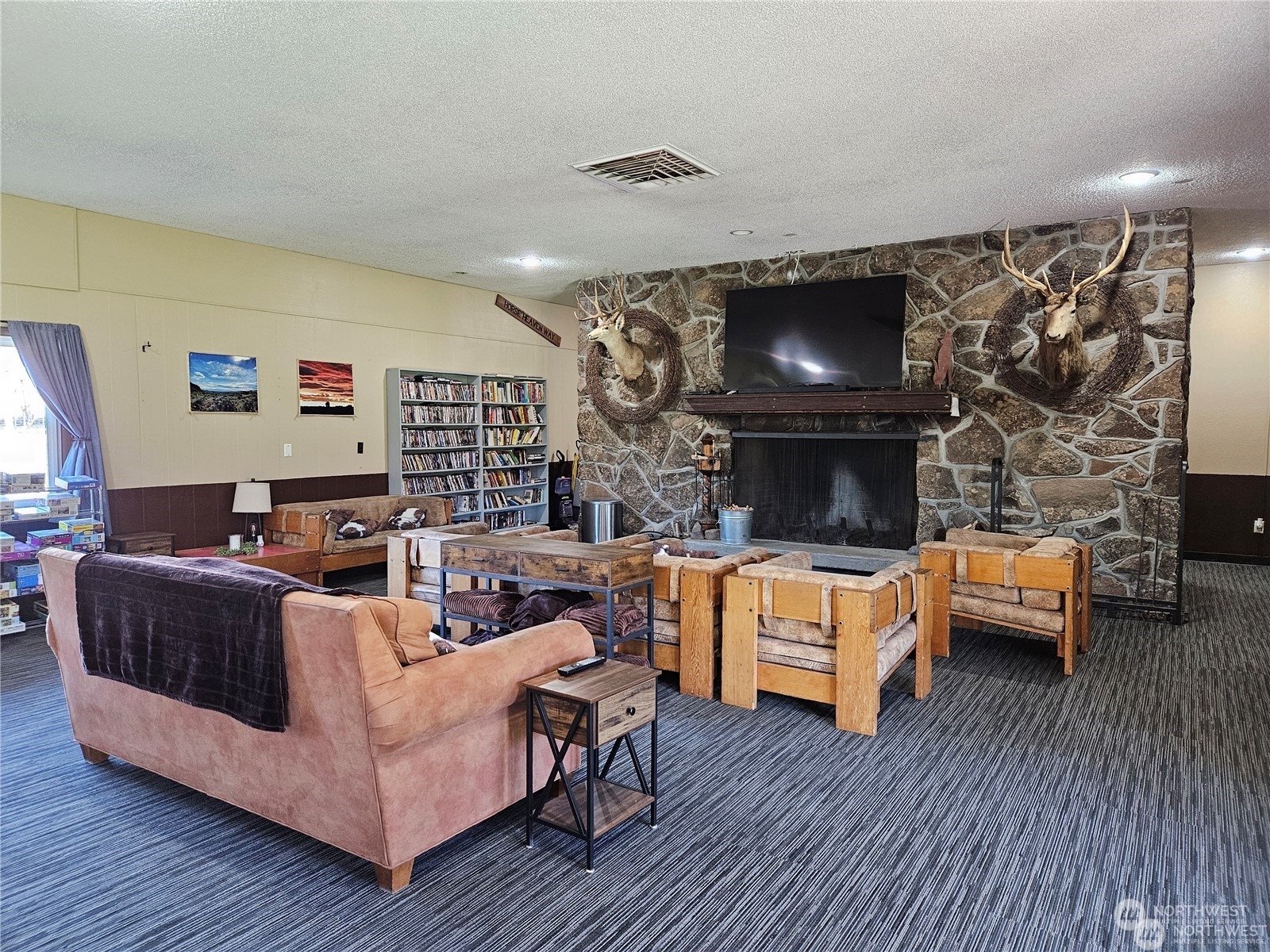 565 Snaffle Court Ephrata, WA 98823 - Photo 15 of 40 a living room with fireplace furniture and a wooden floor