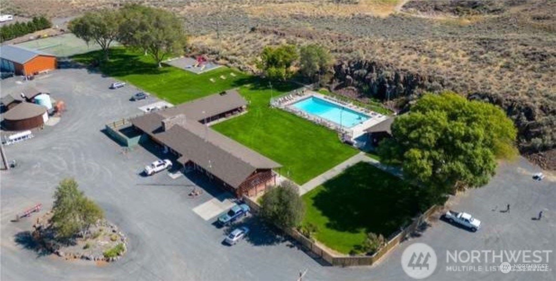 565 Snaffle Court Ephrata, WA 98823 - Photo 38 of 40 an aerial view of a house with a yard and lake view