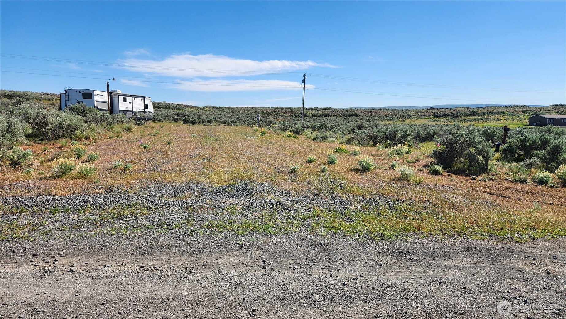565 Snaffle Court Ephrata, WA 98823 - Photo 40 of 40 a view of a lake with beach