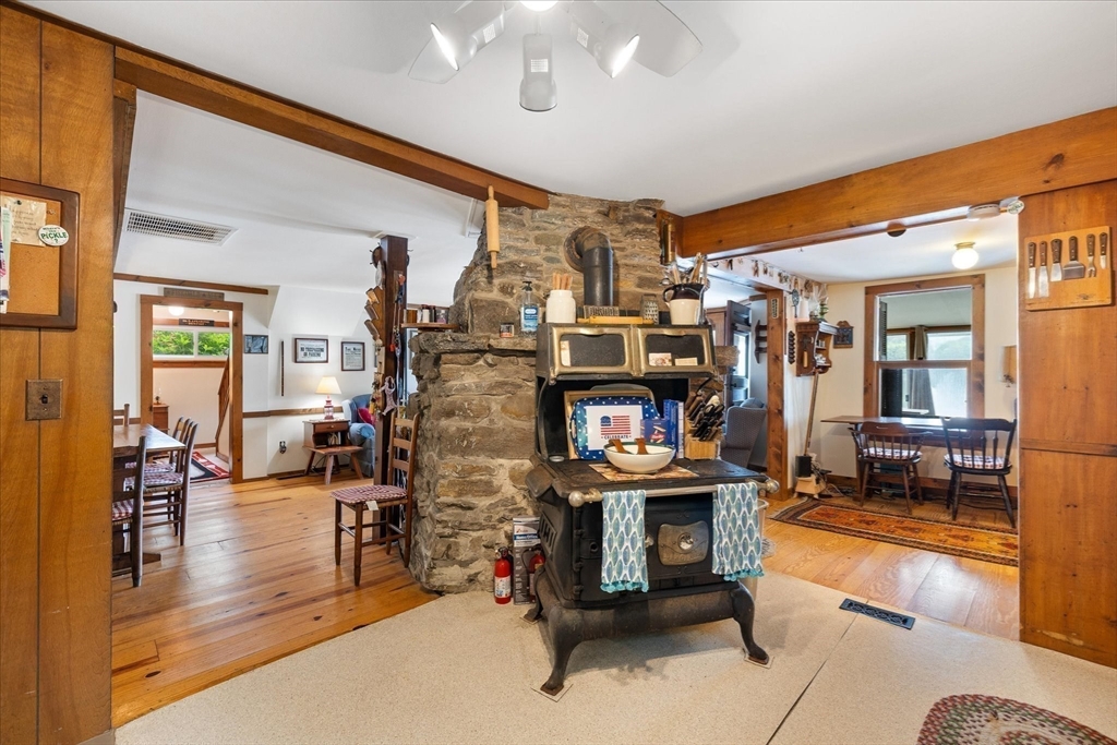 35 Mt Dan Road Sturbridge, MA 01518 - Photo 14 of 37 a living room with lots of furniture and a chandelier