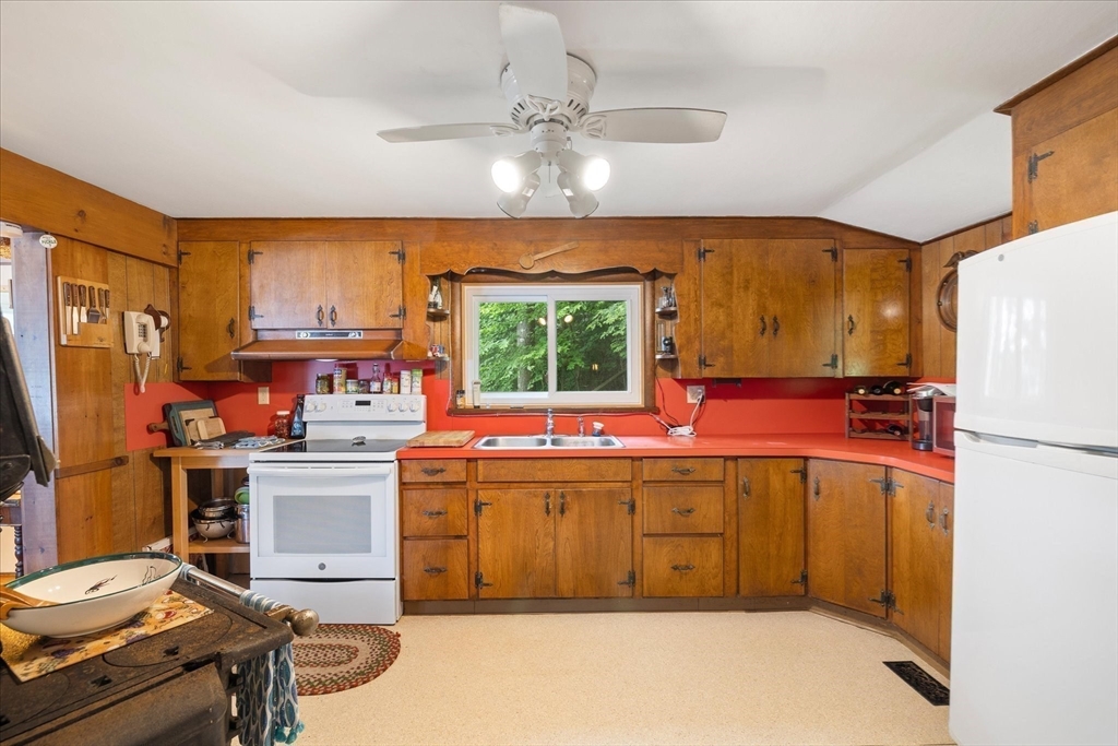 35 Mt Dan Road Sturbridge, MA 01518 - Photo 15 of 37 a kitchen with a stove a refrigerator and a sink