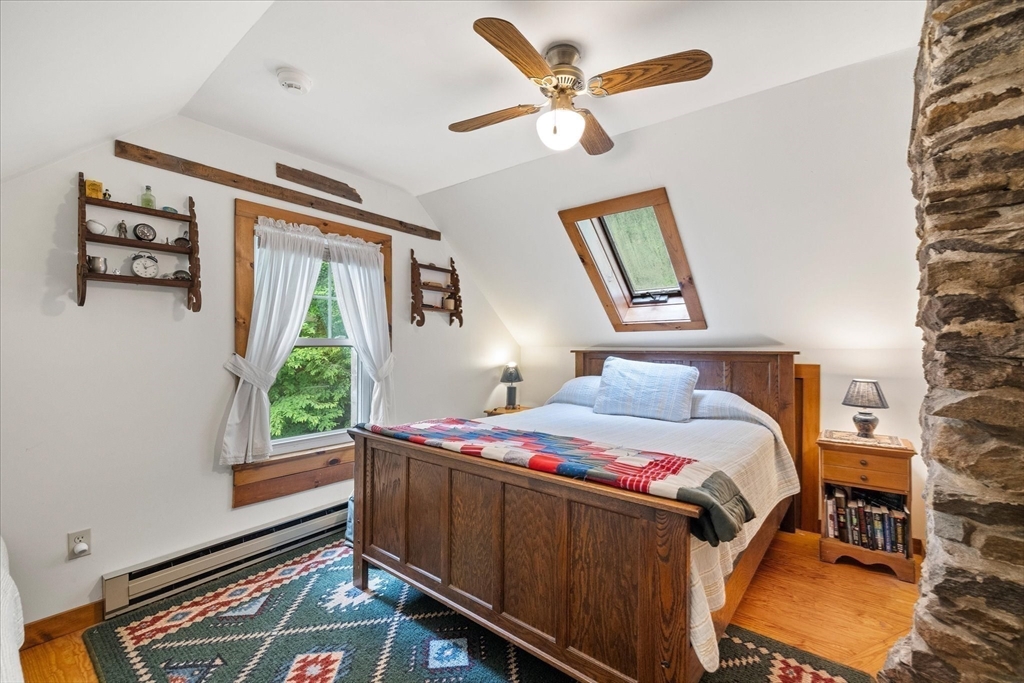 35 Mt Dan Road Sturbridge, MA 01518 - Photo 18 of 37 a bedroom that has a bed and a window