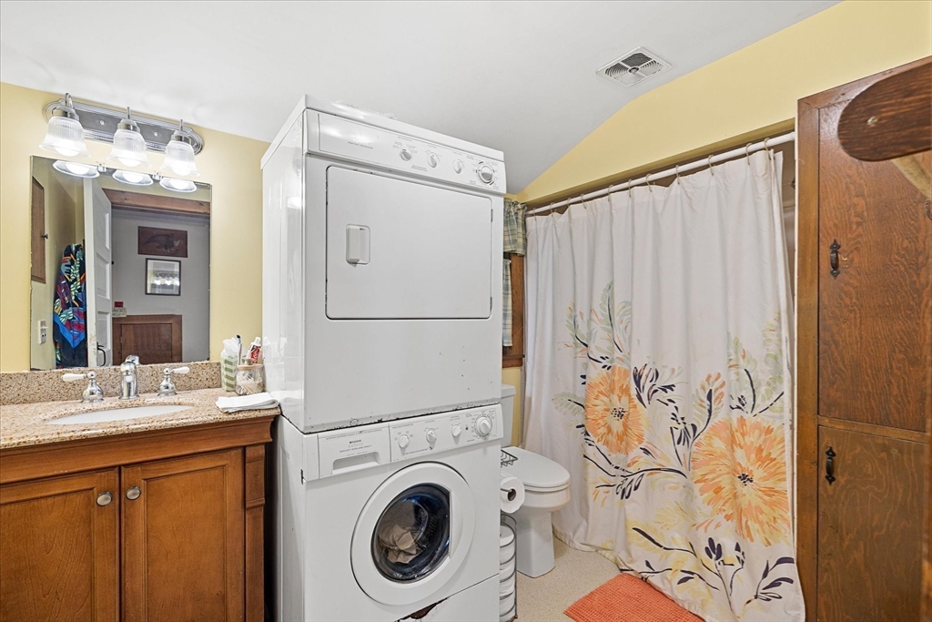 35 Mt Dan Road Sturbridge, MA 01518 - Photo 25 of 37 a bathroom with a sink a washer and dryer