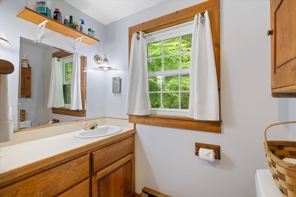 35 Mt Dan Road Sturbridge, MA 01518 - Photo 26 of 37 a bathroom with a sink and a mirror