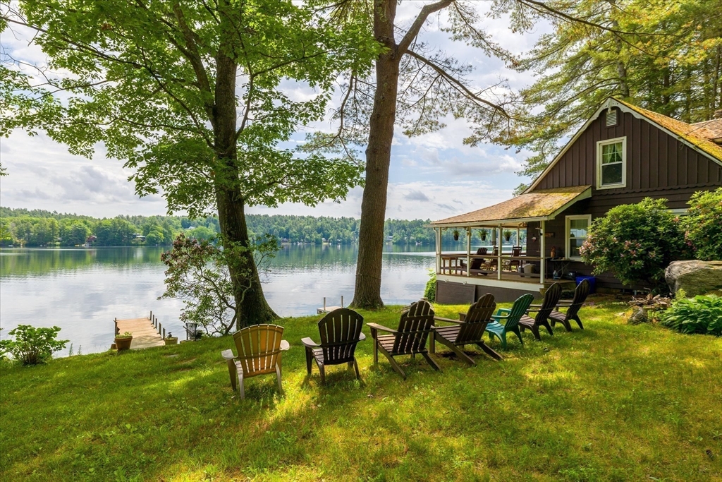 35 Mt Dan Road Sturbridge, MA 01518 - Photo 4 of 37 a view of a lake with a bench and a table chair