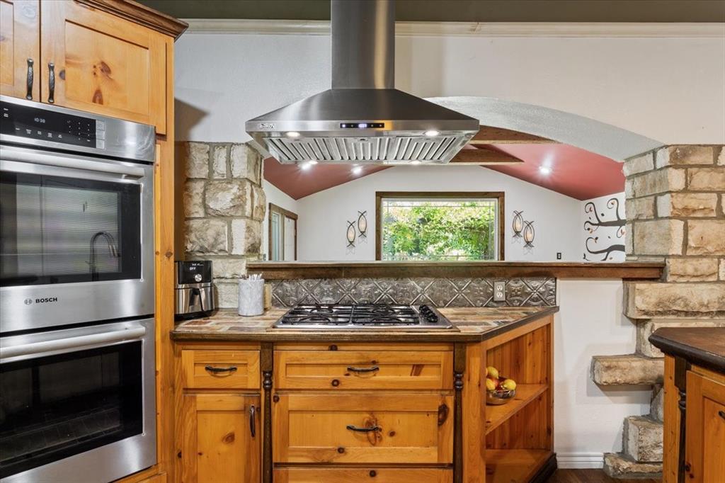 3015 Sturgis Lane Waco, TX 76708 - Photo 12 of 40 a kitchen with stainless steel appliances granite countertop a stove a sink and a microwave