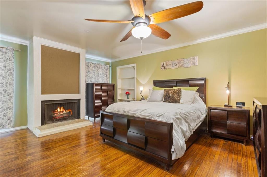 3015 Sturgis Lane Waco, TX 76708 - Photo 18 of 40 a bedroom with a bed and a fireplace