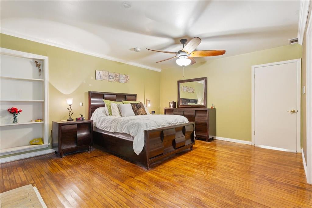 3015 Sturgis Lane Waco, TX 76708 - Photo 19 of 40 a bedroom with a bed and wooden floor