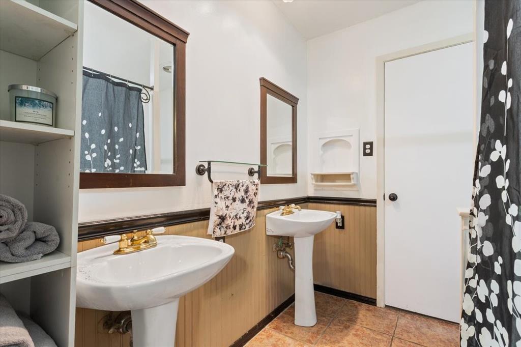 3015 Sturgis Lane Waco, TX 76708 - Photo 26 of 40 a bathroom with a sink a mirror and a toilet