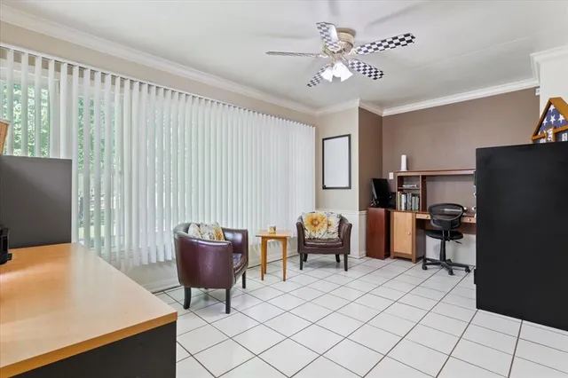 a work room with furniture and a chandelier