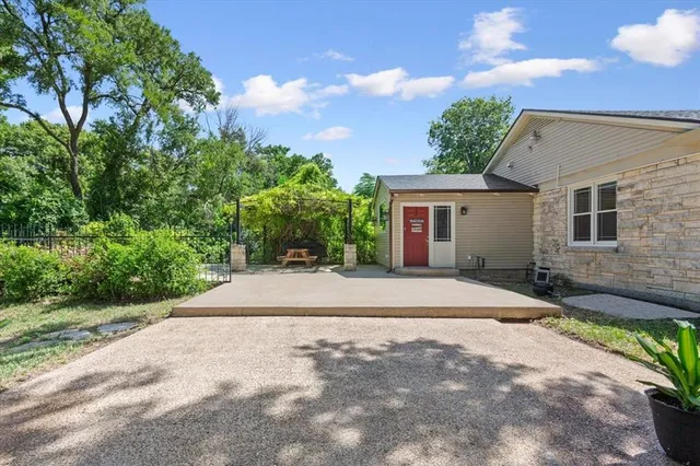 a front view of a house with a yard and a garage