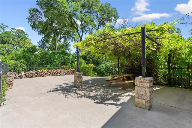 a wooden bench sitting in the middle of a park