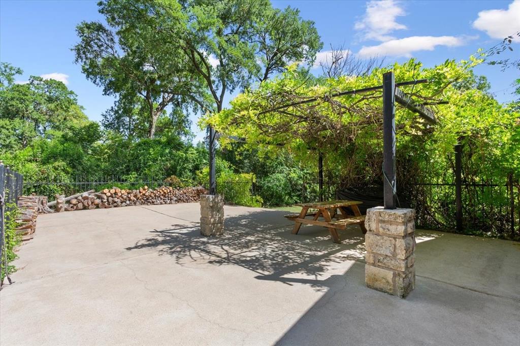 3015 Sturgis Lane Waco, TX 76708 - Photo 33 of 40 a wooden bench sitting in the middle of a park