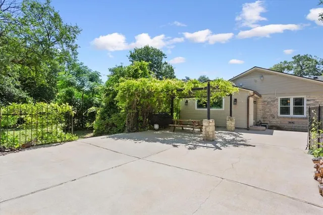 a view of a house with palm trees