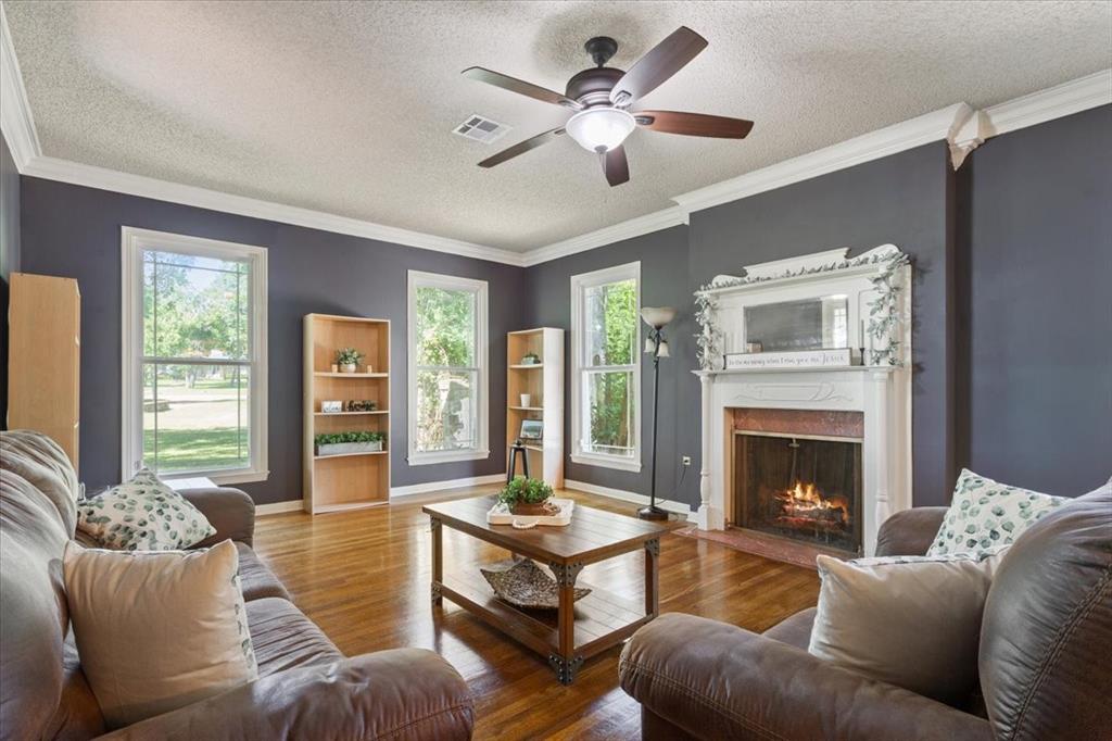 3015 Sturgis Lane Waco, TX 76708 - Photo 6 of 40 a living room with furniture and a fireplace