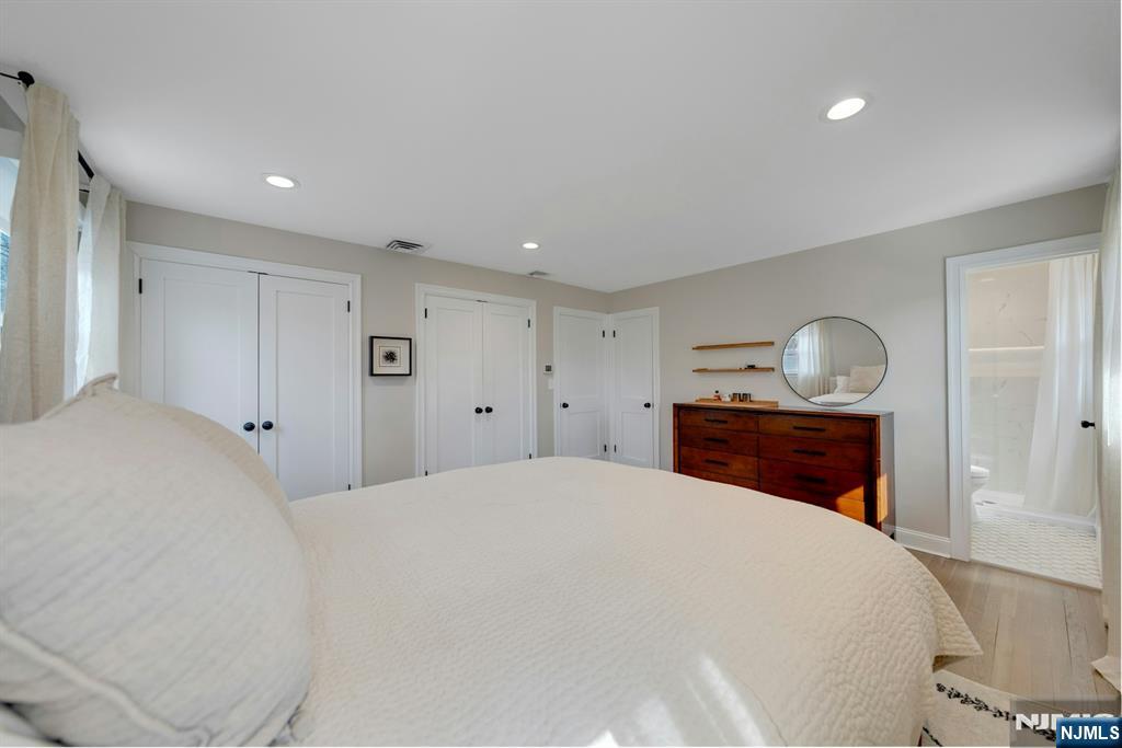 108 Hendrickson Street Haworth, NJ 07641 - Photo 17 of 38 a bedroom with a bed and a lamp