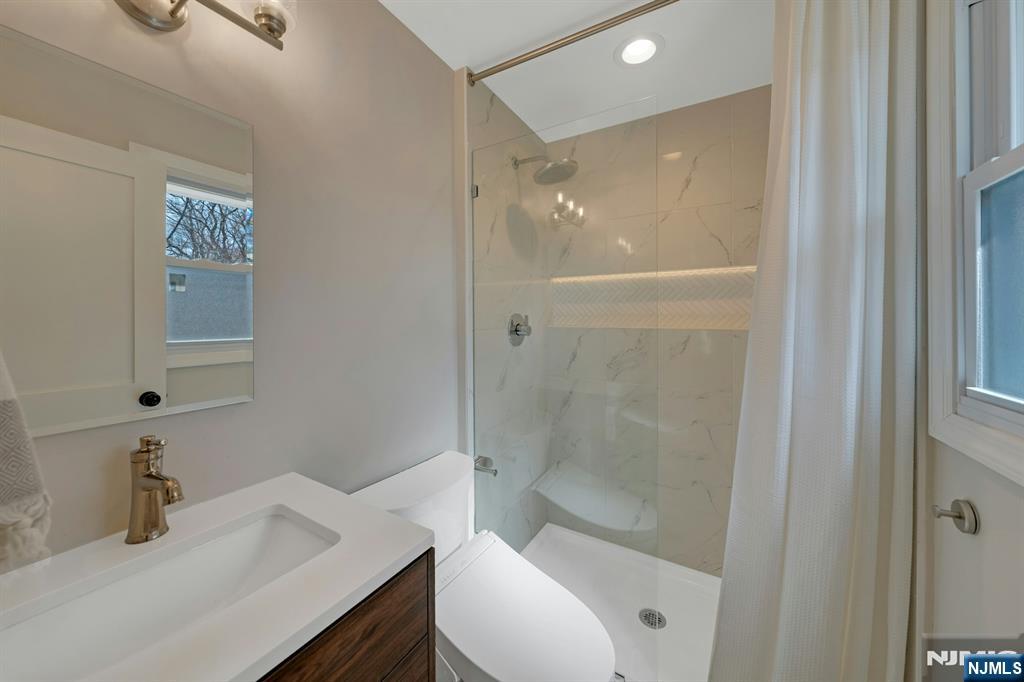 108 Hendrickson Street Haworth, NJ 07641 - Photo 18 of 38 a bathroom with a sink toilet and shower