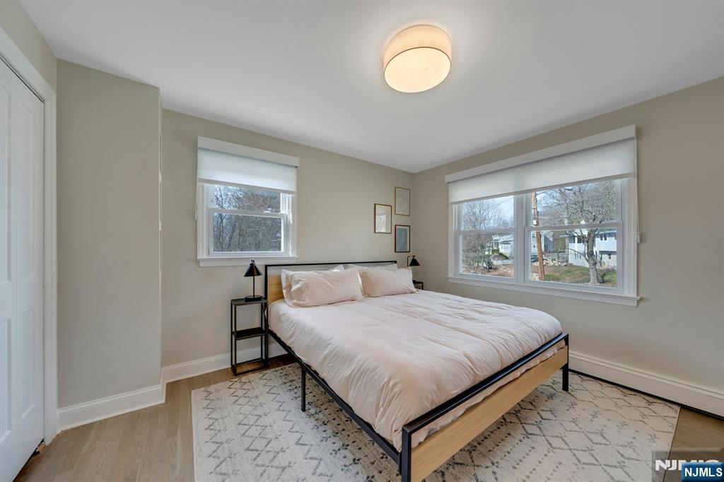 108 Hendrickson Street Haworth, NJ 07641 - Photo 19 of 38 a bed sitting in a bedroom next to a window