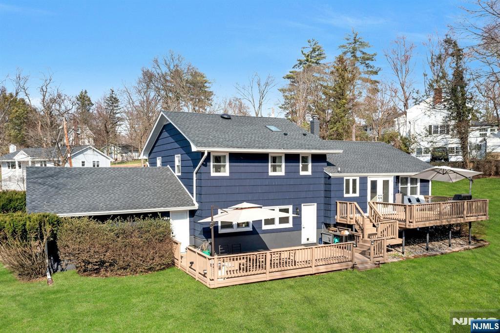 108 Hendrickson Street Haworth, NJ 07641 - Photo 2 of 38 a view of a house with a yard porch and sitting area
