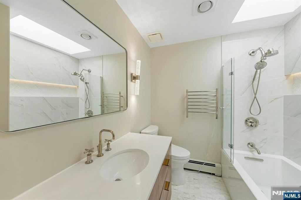 108 Hendrickson Street Haworth, NJ 07641 - Photo 21 of 38 a bathroom with a sink toilet and shower