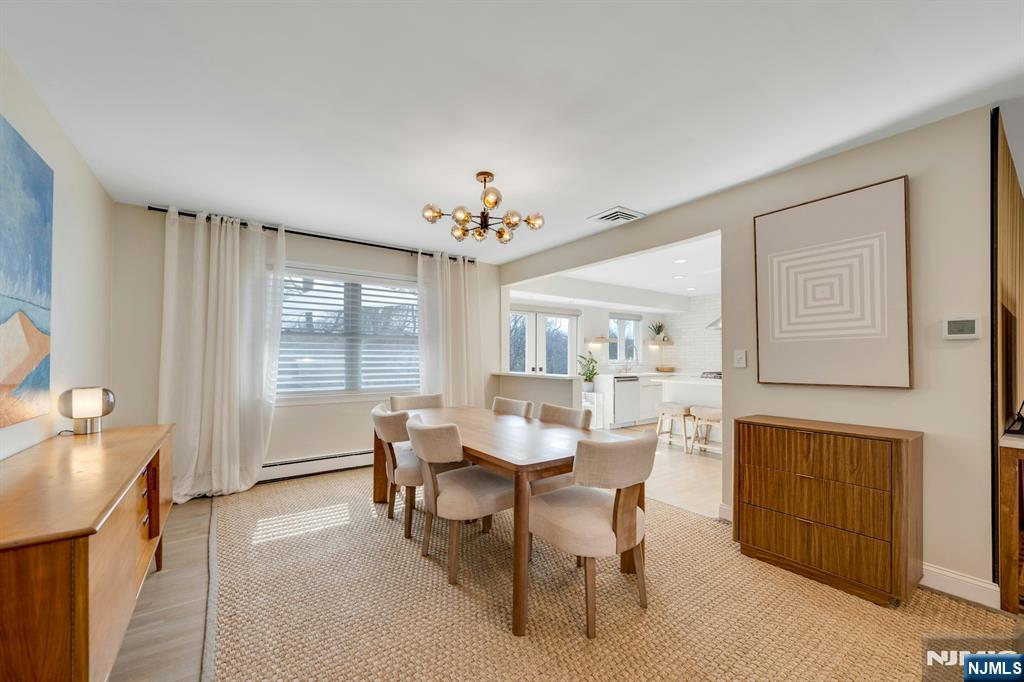 108 Hendrickson Street Haworth, NJ 07641 - Photo 10 of 38 a view of a dining room with furniture and chandelier