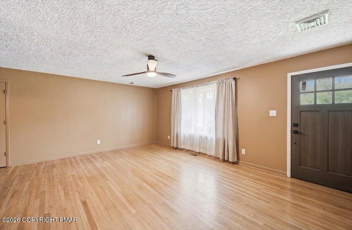 345 Laurel Lake Road Bartonsville, PA 18321 - Photo 12 of 82 wooden floor in an empty room with a window