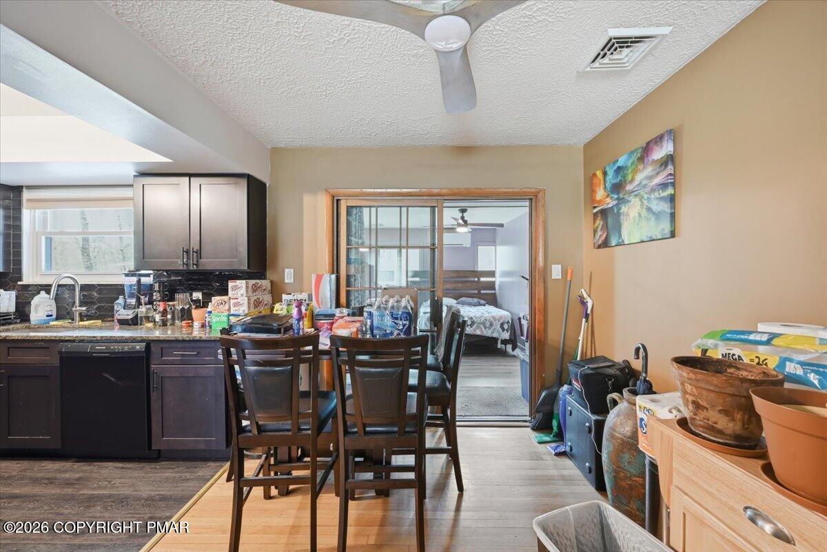 345 Laurel Lake Road Bartonsville, PA 18321 - Photo 13 of 82 a view of a dining room with furniture and chandelier