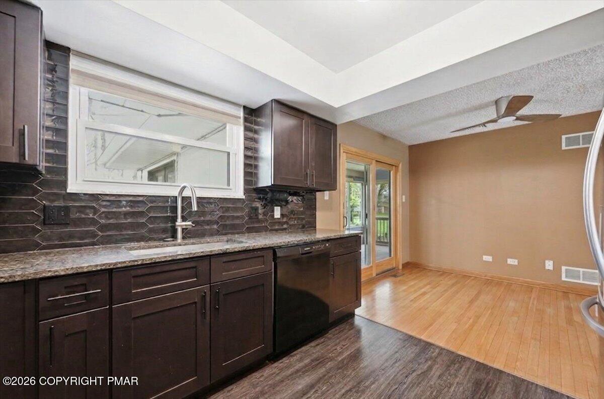 345 Laurel Lake Road Bartonsville, PA 18321 - Photo 18 of 82 a kitchen with a sink and wooden floor