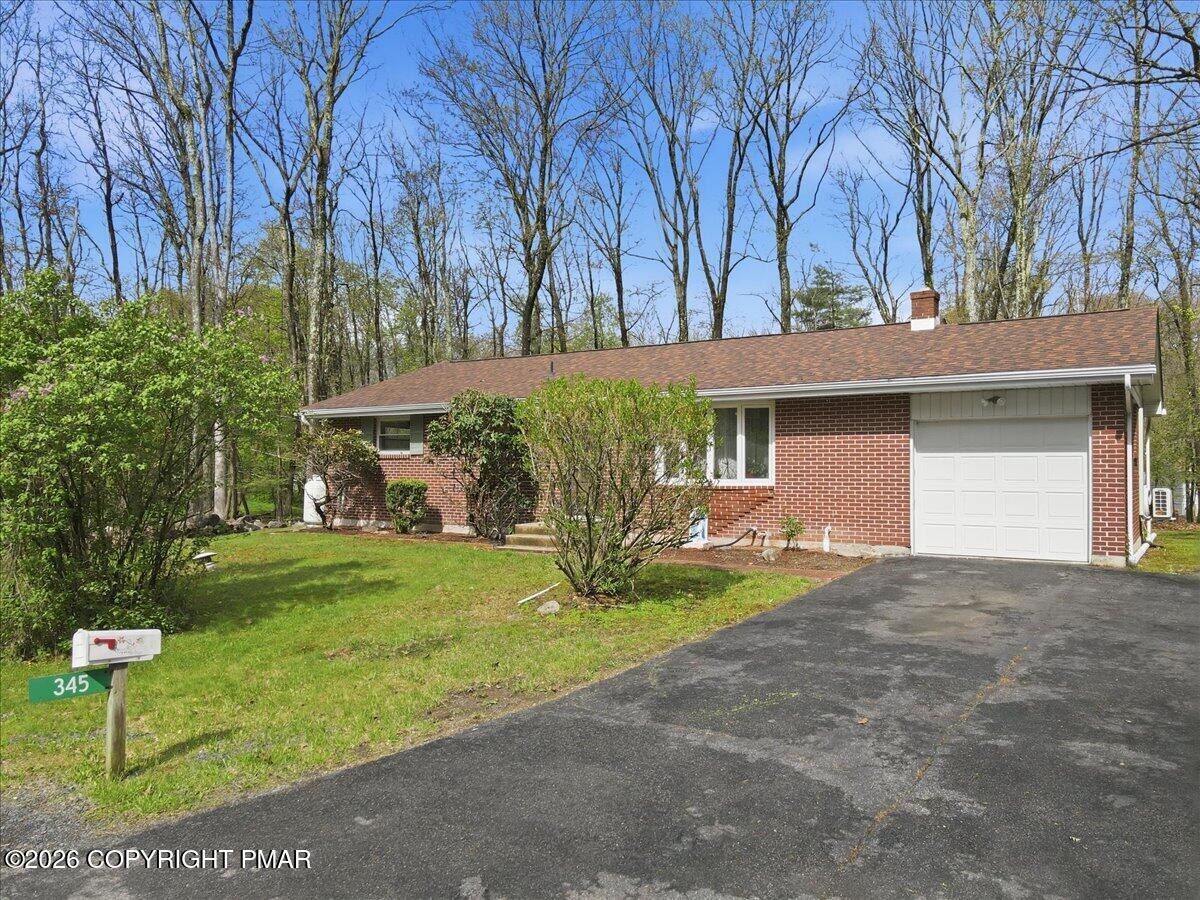 345 Laurel Lake Road Bartonsville, PA 18321 - Photo 2 of 82 a view of a house with backyard and a tree