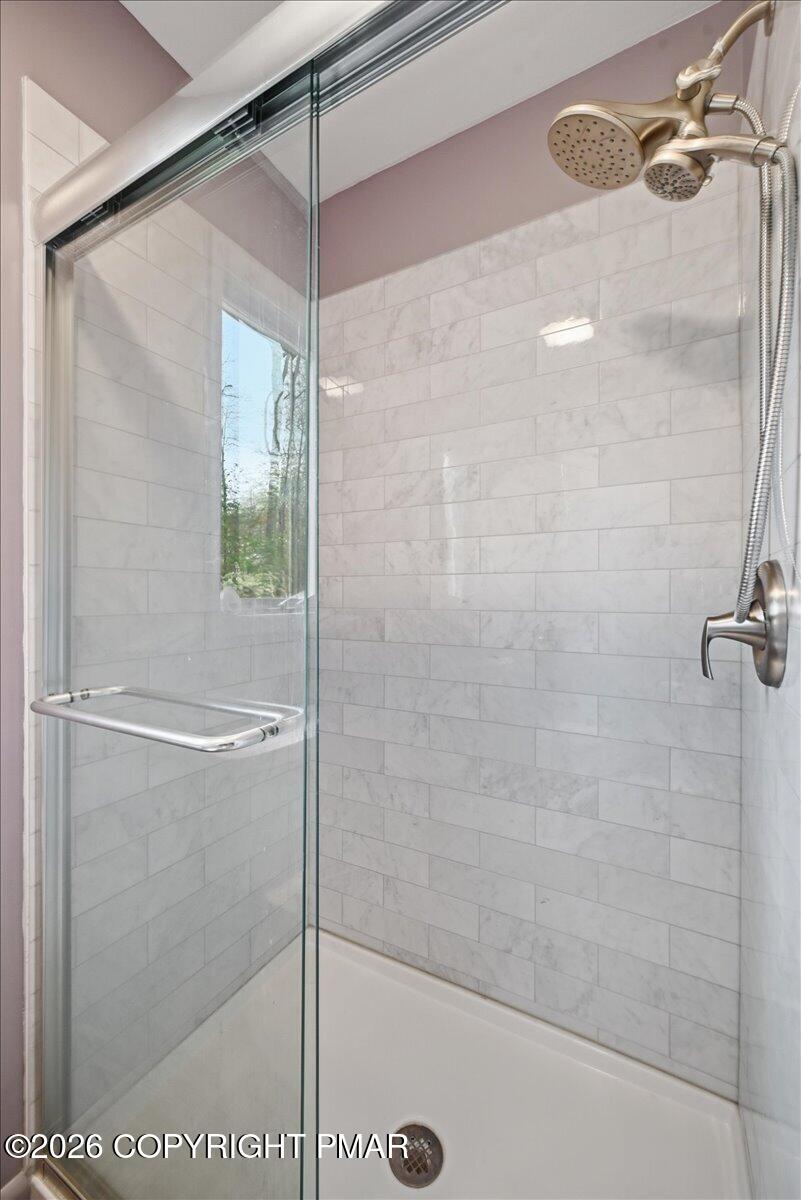 345 Laurel Lake Road Bartonsville, PA 18321 - Photo 26 of 82 a bathroom with a glass shower door