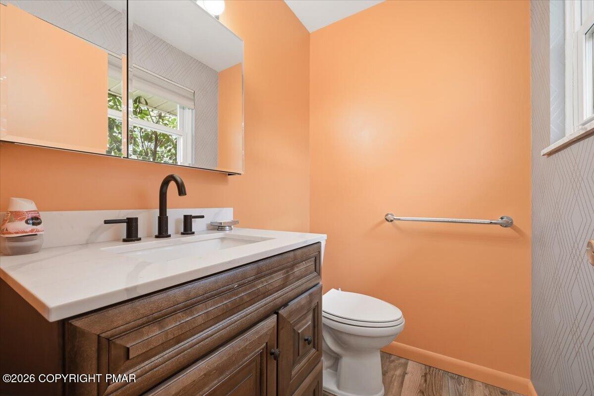345 Laurel Lake Road Bartonsville, PA 18321 - Photo 29 of 82 a bathroom with a sink a toilet and a window