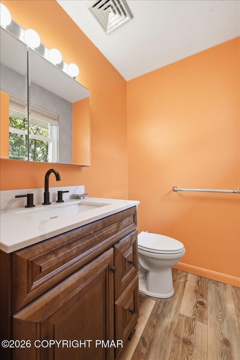 345 Laurel Lake Road Bartonsville, PA 18321 - Photo 30 of 82 a bathroom with a sink a toilet and mirror