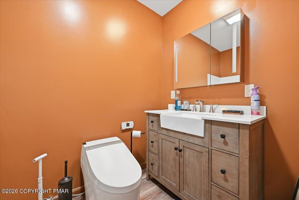 345 Laurel Lake Road Bartonsville, PA 18321 - Photo 33 of 82 a bathroom with a toilet a sink and mirror