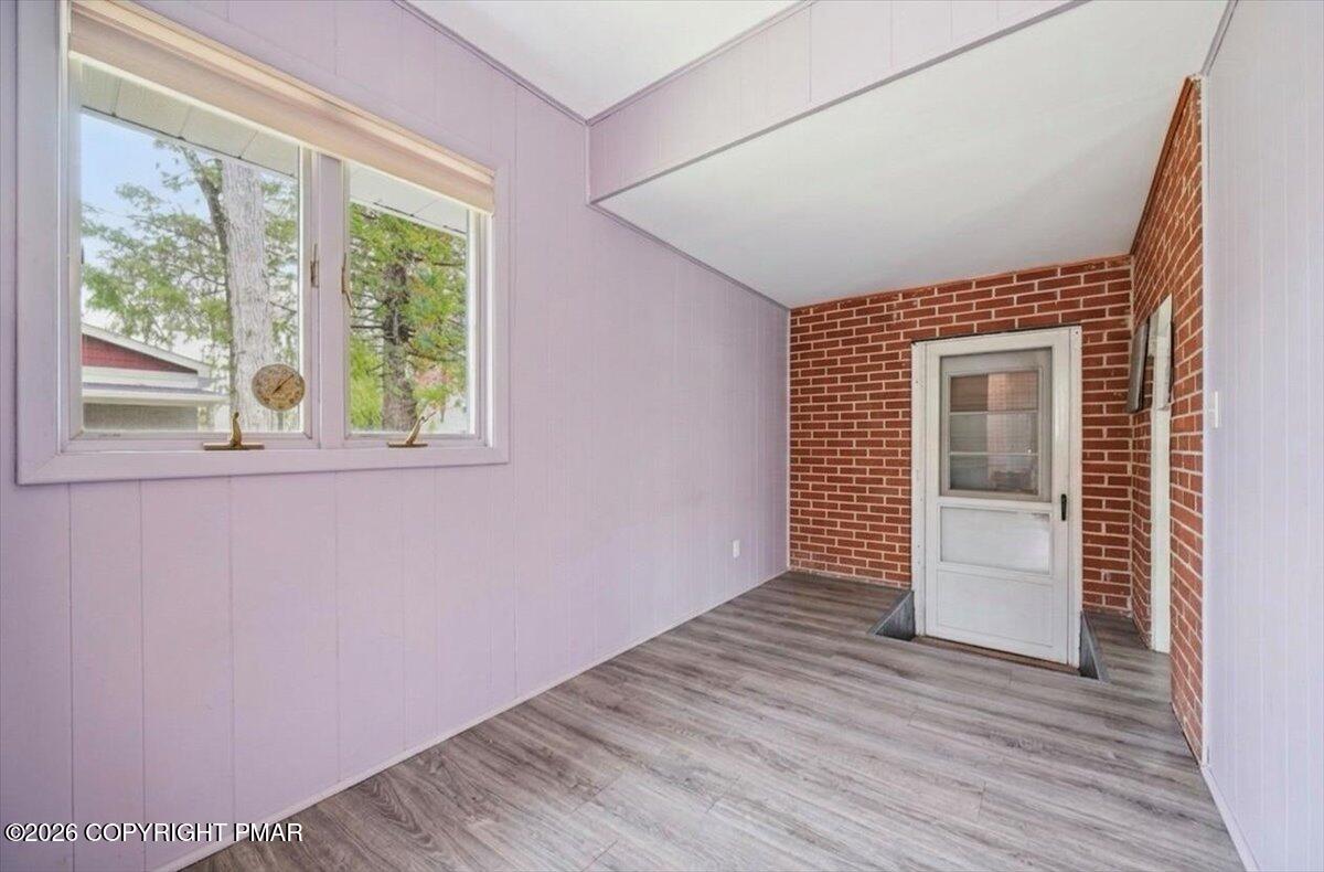 345 Laurel Lake Road Bartonsville, PA 18321 - Photo 36 of 82 an empty room with wooden floor and windows