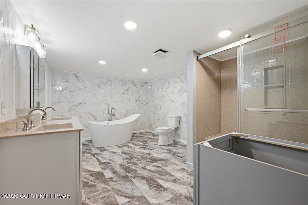 345 Laurel Lake Road Bartonsville, PA 18321 - Photo 50 of 82 a bathroom with a bathtub and a sink