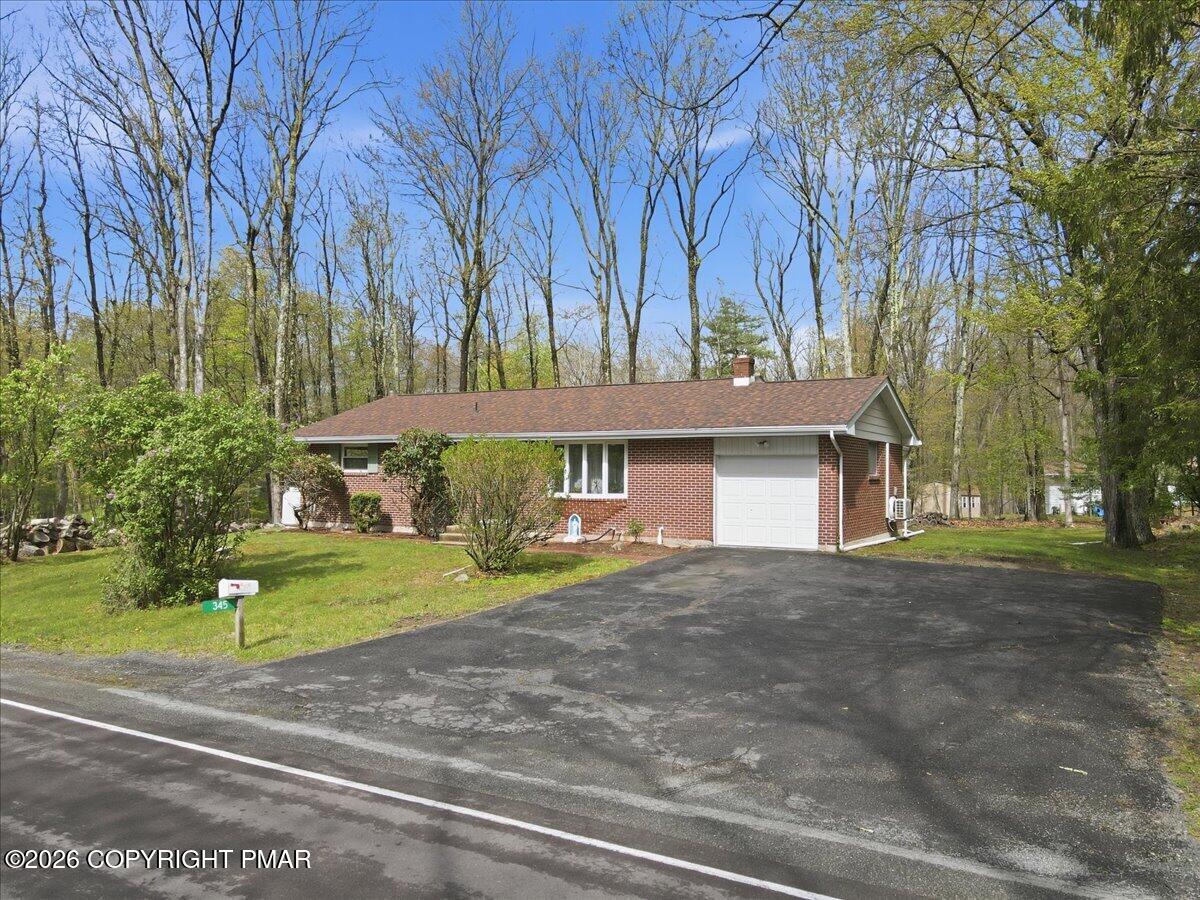 345 Laurel Lake Road Bartonsville, PA 18321 - Photo 5 of 82 a view of a house with a yard and tree s